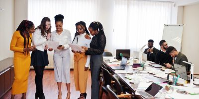 Diverse business people on a meeting at round table. Diverse business people on a meeting at round table.